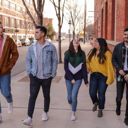 friends walking in Jordan Neighborhood of Minneapolis