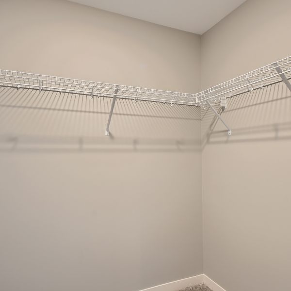 clothes in walk-in closet